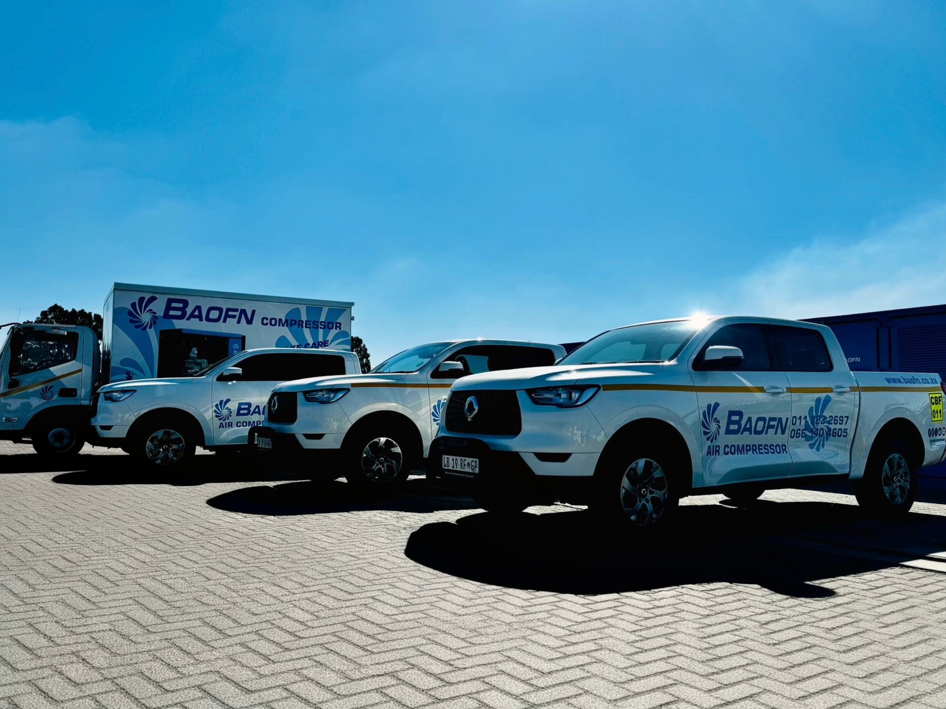 BAOFN service fleet and a compressor on a trailer at a customer site